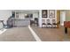 Spacious carpeted living room with a large gray couch, TV, and various decor elements at 3741 Harvard Pl, Broomfield, CO 80023
