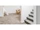 Finished basement with stairs, neutral carpet, and comfortable lounge furniture and play tent at 6580 Independence Way, Arvada, CO 80004