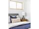 Comfortable bedroom with soft bedding, neutral decor and natural light from bright, warm windows at 6580 Independence Way, Arvada, CO 80004
