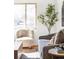 Bright living room with decorative rug, featuring modern furniture, decor and hardwood floors at 6580 Independence Way, Arvada, CO 80004