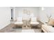 Relaxing living room showcases stylish decor, with chairs, table, and a cozy teepee for playful moments at 6580 Independence Way, Arvada, CO 80004