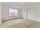 Bedroom with neutral carpet, closet, and lots of natural light at 39857 Floyd St, Elizabeth, CO 80107