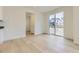 Bright dining room with sliding glass doors and light wood floors at 39857 Floyd St, Elizabeth, CO 80107