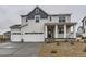 Charming two-story home with a three-car garage and inviting front porch at 39857 Floyd St, Elizabeth, CO 80107