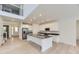 Open kitchen with stainless steel appliances and large center island at 39857 Floyd St, Elizabeth, CO 80107
