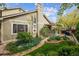 Charming home exterior with lush landscaping, well-maintained lawn, and paver walkway at 17038 Lamar Dr, Parker, CO 80134