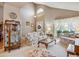 Cozy living room featuring floral patterned furniture, bright natural light, and neutral color palette at 17038 Lamar Dr, Parker, CO 80134