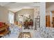 Open concept living room and dining area with hardwood floors and neutral wall paint at 17038 Lamar Dr, Parker, CO 80134