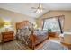 Comfortable main bedroom features a king size bed, hardwood floors and a ceiling fan at 17038 Lamar Dr, Parker, CO 80134