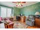 Home office complete with desk, chair, lamps, a futon and a plush recliner at 17038 Lamar Dr, Parker, CO 80134