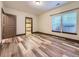 A bedroom with hardwood flooring, a closet and two windows at 1648 Exquisite St, Castle Rock, CO 80109