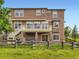 Large two-story home with fenced yard, back patio, and beautiful landscaping at 1648 Exquisite St, Castle Rock, CO 80109