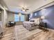 Main bedroom featuring elegant décor, tray ceiling, and large windows at 1648 Exquisite St, Castle Rock, CO 80109