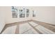 Bedroom with neutral colored carpet, bright windows, and closet at 615 Twilight St, Erie, CO 80516