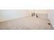 Upstairs hallway area with neutral colored carpet and railing at 615 Twilight St, Erie, CO 80516