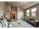 Cozy bedroom features multiple windows, a closet, and an adjoining room at 1379 Charles # 4, Longmont, CO 80503