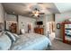 Comfortable bedroom featuring neutral tones, ceiling fan, walk-in closet, and dresser at 1379 Charles # 4, Longmont, CO 80503