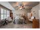 Bright bedroom features a vaulted ceiling, a ceiling fan, and a wrought iron bed frame at 1379 Charles # 4, Longmont, CO 80503