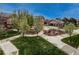 Beautifully maintained community green space featuring mature trees, walkways, and a covered picnic area at 1379 Charles # 4, Longmont, CO 80503