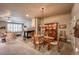 Cozy dining area with fireplace, wood table, china cabinet, and view to living room at 1379 Charles # 4, Longmont, CO 80503