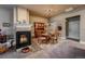 Cozy dining room featuring a fireplace, classic wood furniture, and neutral tones at 1379 Charles # 4, Longmont, CO 80503