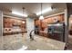 Spacious kitchen with stainless steel appliances, granite countertops, and wood cabinetry at 1379 Charles # 4, Longmont, CO 80503