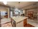 Open-concept kitchen with center island, granite counters, stainless steel appliances, and view to living and dining areas at 1379 Charles # 4, Longmont, CO 80503