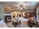 Open-concept living room with a fireplace, connecting to a dining area and kitchen at 1379 Charles # 4, Longmont, CO 80503