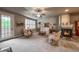 Bright and airy living room with neutral decor, fireplace, and shuttered windows at 1379 Charles # 4, Longmont, CO 80503