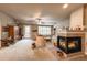 Comfortable living room with a fireplace, plush seating, and natural light at 1379 Charles # 4, Longmont, CO 80503