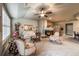 Inviting living room featuring a fireplace and comfortable seating, connecting to a dining area at 1379 Charles # 4, Longmont, CO 80503