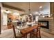 Open living space with fireplace, dining area, and kitchen featuring granite countertops at 1379 Charles # 4, Longmont, CO 80503