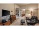 Cozy living space with a desk and chair, and a view into the dining and kitchen areas at 1379 Charles # 4, Longmont, CO 80503