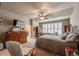Serene main bedroom with a window, dresser, sitting area, and walk-in closet at 1379 Charles # 4, Longmont, CO 80503