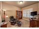 Comfortable office with a bookshelf, reading chair, and desk at 1379 Charles # 4, Longmont, CO 80503