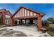 Covered picnic area with brick columns, concrete floors, and tables with chairs, perfect for outdoor gatherings at 1379 Charles # 4, Longmont, CO 80503