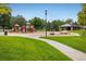A colorful playground with slides, swings, and climbing structures provides a safe and fun environment at 1379 Charles # 4, Longmont, CO 80503
