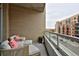Cozy balcony providing outdoor seating, brick siding, and unobstructed neighborhood views at 4200 W 17Th Ave # 323, Denver, CO 80204
