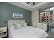 Inviting bedroom with soft lighting, a comfortable bed, and a view of the cityscape at 4200 W 17Th Ave # 323, Denver, CO 80204