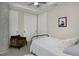Stylish bedroom featuring a decorative ceiling fan, clean white doors, and plush accents at 4200 W 17Th Ave # 323, Denver, CO 80204