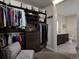 Well-organized walk-in closet offering custom shelving, drawers, and convenient access to the en-suite bathroom at 4200 W 17Th Ave # 323, Denver, CO 80204
