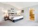 Comfortable bedroom featuring an attached bathroom and neutral decor at 19113 W 60Th Ln, Golden, CO 80403