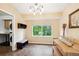 Versatile flex room with a large window, a bench, and neutral tones at 19113 W 60Th Ln, Golden, CO 80403