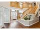 Spacious foyer with hardwood floors, a beautiful staircase, and an elegant chandelier at 19113 W 60Th Ln, Golden, CO 80403