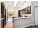 Modern kitchen with granite countertops, black cabinetry, and stainless steel appliances, perfect for cooking at 19113 W 60Th Ln, Golden, CO 80403