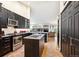 A kitchen with granite countertops, stainless steel appliances, and a cozy island with a sink at 19113 W 60Th Ln, Golden, CO 80403
