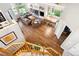 Bright living room features wood floors, a fireplace, large windows, and a dining area with room to entertain at 19113 W 60Th Ln, Golden, CO 80403