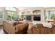 Cozy living room featuring hardwood floors, a fireplace, and comfortable seating at 19113 W 60Th Ln, Golden, CO 80403