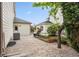 This backyard features a rock garden, mature landscaping, and a detached garage for extra parking or storage at 17391 E Weaver Ave, Aurora, CO 80016
