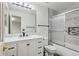 Bathroom with modern vanity, marble countertop, and shower with glass doors at 17391 E Weaver Ave, Aurora, CO 80016
